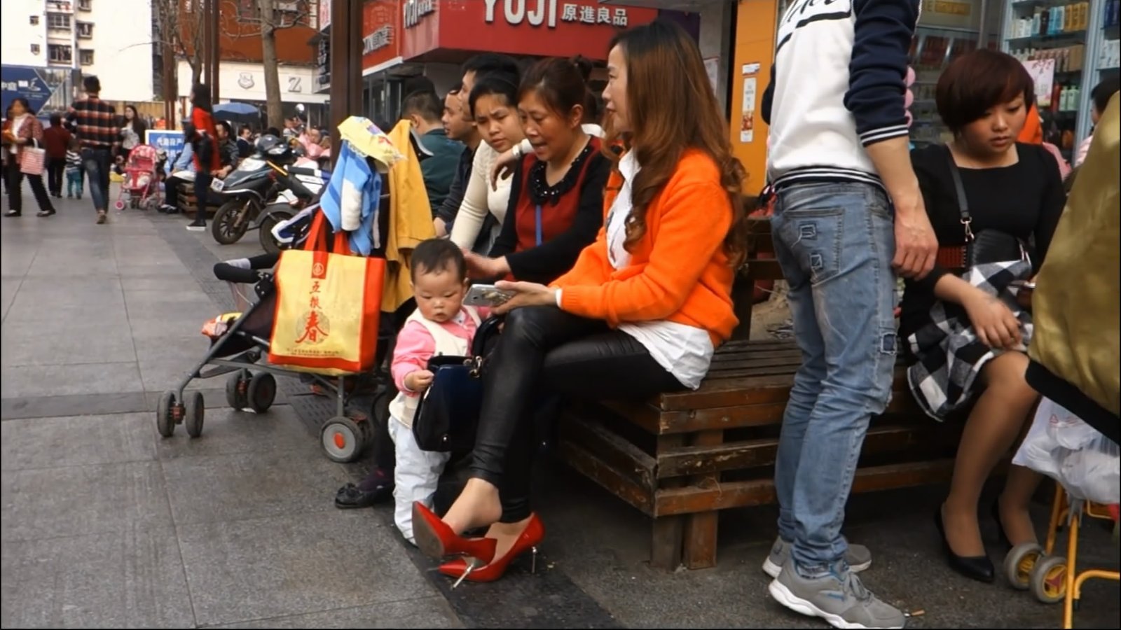 &quot;Blue and black and the girl with her legs dangling &quot;